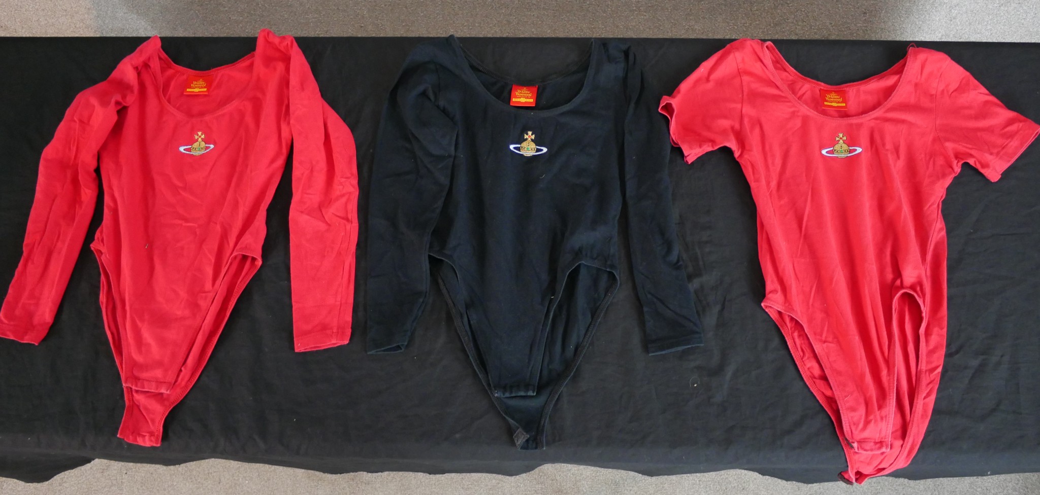 Two red and a black Vivienne Westwood leotards H.60 W.36cm