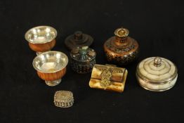 Two 20th century white metal and wooden betel dishes, together with an Indian white metal pill