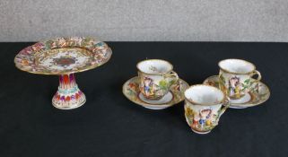 Six pieces of 19th century Italian Capodimonte comprised three cups, two saucers and a crested
