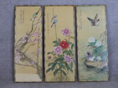 A set of three 20th century Chinese watercolours on silk panels painted with birds and flowers, each