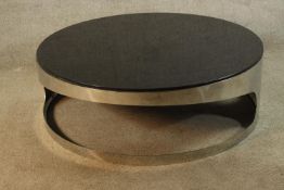After Gallotti & Radice, a contemporary stainless steel and glass topped 'Tab' circular occasional