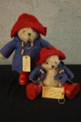 Two 20th century Paddington Bears, complete with duffle coats. H.37cm. (largest)