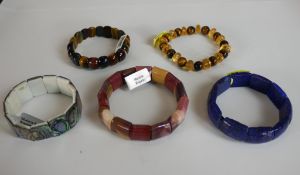 Five elasticated statement gemstone bracelets, including tiger-eye, Mookite, Lapis Lazuli, Abalone