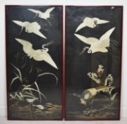 A pair of late 19th century Japanese silk panels embroidered with cranes and other birds by a