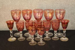 A set of ten 19th century cranberry glass drinking glasses together with four other ruby glass