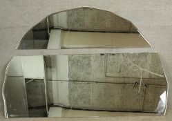 A large contemporary brushed steel framed arch topped wall mirror. H.136 W.198cm.