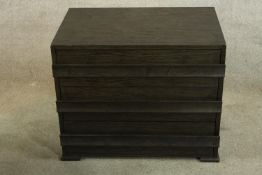 A contemporary painted chest of three long drawers raised on shaped bracket feet. H.58 W.71cm.