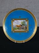 A 19th century Minton handpainted porcelain plate, the central panel decorated with cattle by a