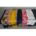 Seven assorted vintage pattened silk scarves.