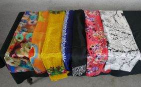 Seven assorted vintage pattened silk scarves.