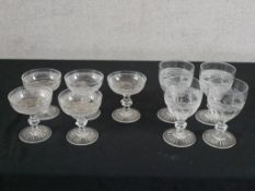Five early 20th century cut glass coup glasses with central faceted knop stem raised on incised '
