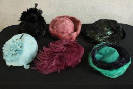 A collection of six 20th century style feathered women’s hats.