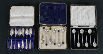 Three cased sets of silver and silver plated coffee spoons, including two sets of silver coffee