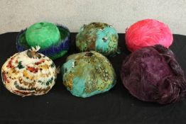 A collection of six 20th century style feathered women’s hats.