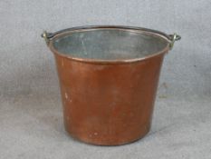 A 19th century copper pail with swing handle. H.41 W.45 D.45cm