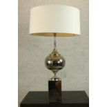 A mid 20th century chrome table lamp after Philippe Barbier, raised on block plinth base. H.93 Dia.