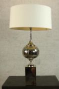 A mid 20th century chrome table lamp after Philippe Barbier, raised on block plinth base. H.93 Dia.