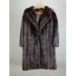 A ladies vintage brown fur ladies full length jacket. H.110 W.60