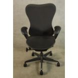 A contemporary Herman Miller adjustable desk chair raised on five splayed supports terminating in