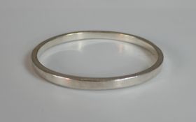 A boxed white metal (tests as silver) bangle. H.6 W.9 D.9cm