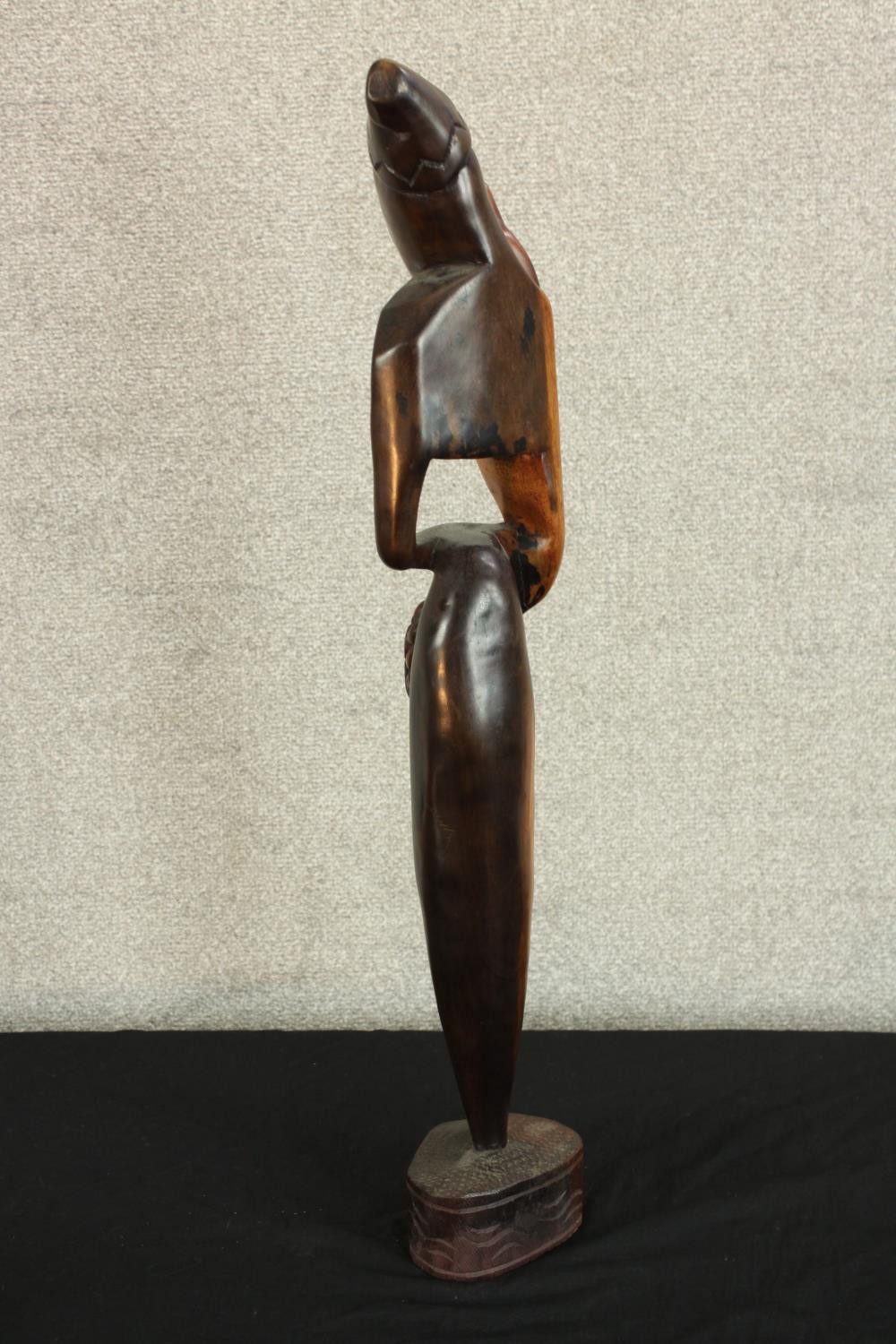 A 20th century carved African hardwood tribal figure raised on shaped base. H.73cm. - Image 3 of 3