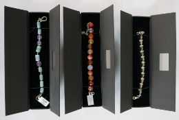 Three boxed Rocks and Co gemstone bracelets, including a faceted carnelian bead bracelet with silver
