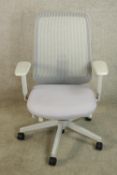 A contemporary Herman Miller adjustable office chair raised on five splayed supports terminating