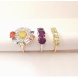 Three 20th century 10 carat gold gem-set rings: an abstract design ring set with Ethiopian fire