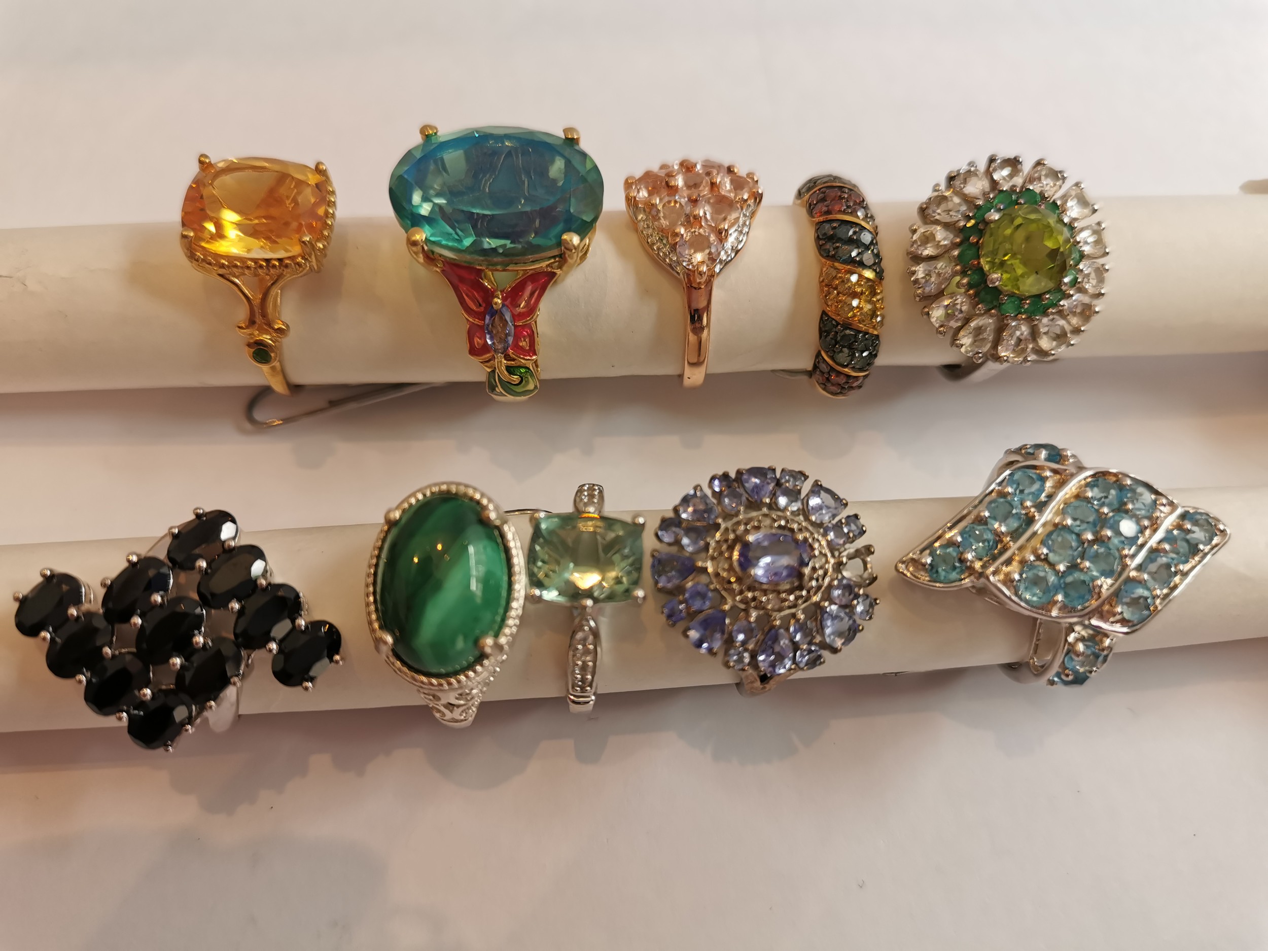 A collection of ten silver and gold plated silver dress rings some set with gemstones, including