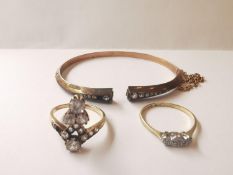 A collection of yellow metal and 9 carat gold jewellery. A three stone diamond ring, a rose gold