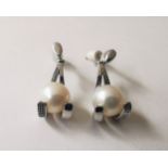 A pair of 20th century 18 carat white gold and white cultured pearl drop earrings, the earrings in