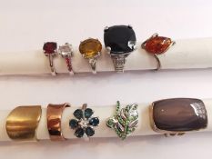 A collection of ten silver and gold plated silver dress rings some set with various gemstones,