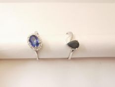 Two 20th century 18 carat white gold gem-set rings: a sapphire and diamond cluster ring, set to