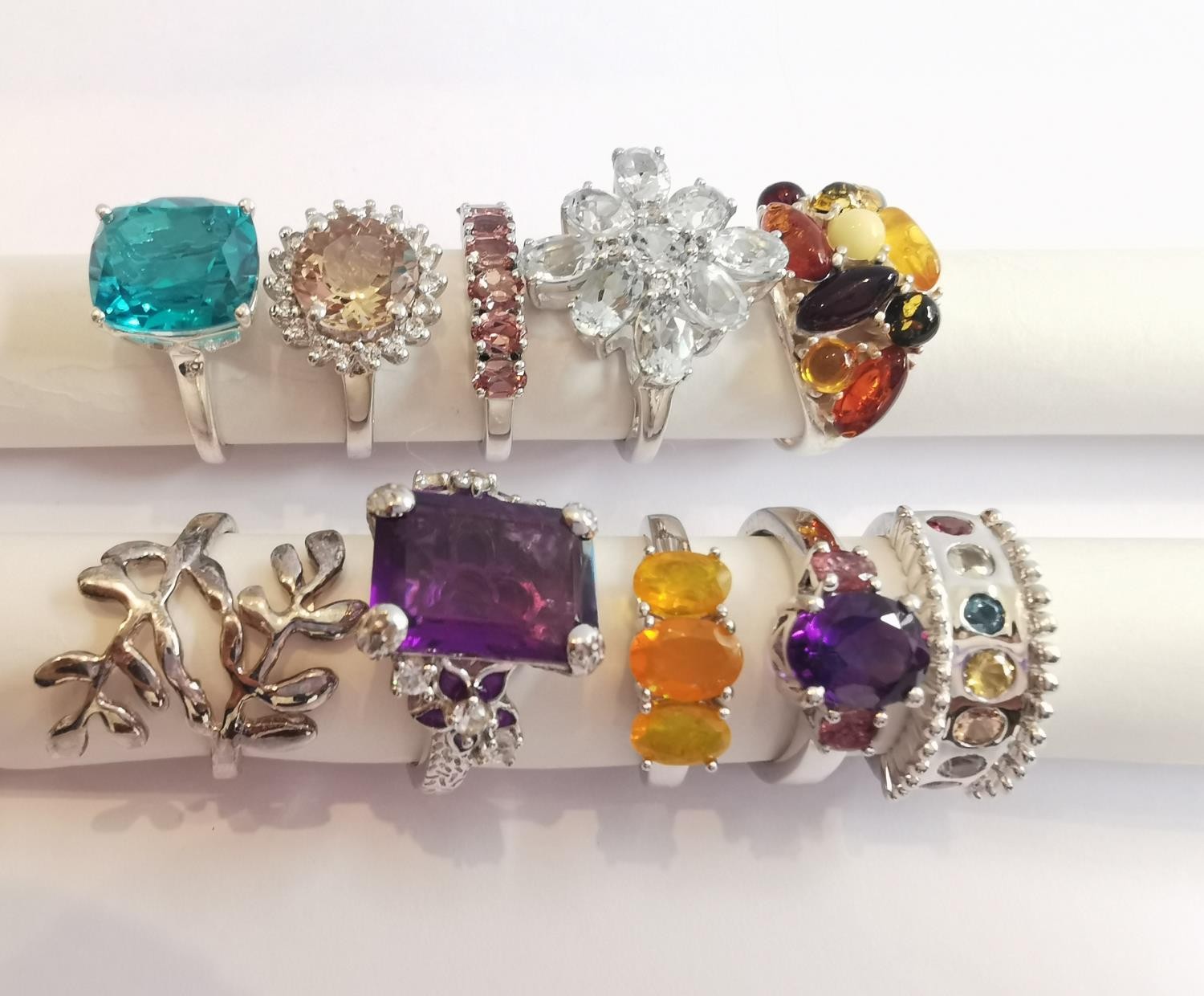 A collection of ten silver and gold plated silver dress rings some set with gemstones, including