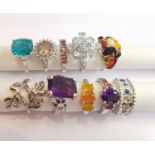 A collection of ten silver and gold plated silver dress rings some set with gemstones, including