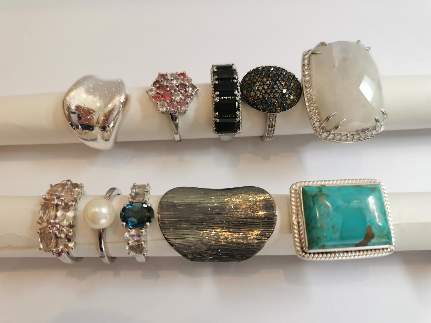 A collection of ten silver and gold plated silver dress rings some set with gemstones, including