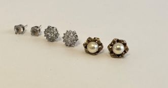 Three pairs of stud earrings, including a pair of 9ct yellow gold and cultured pearl earrings.