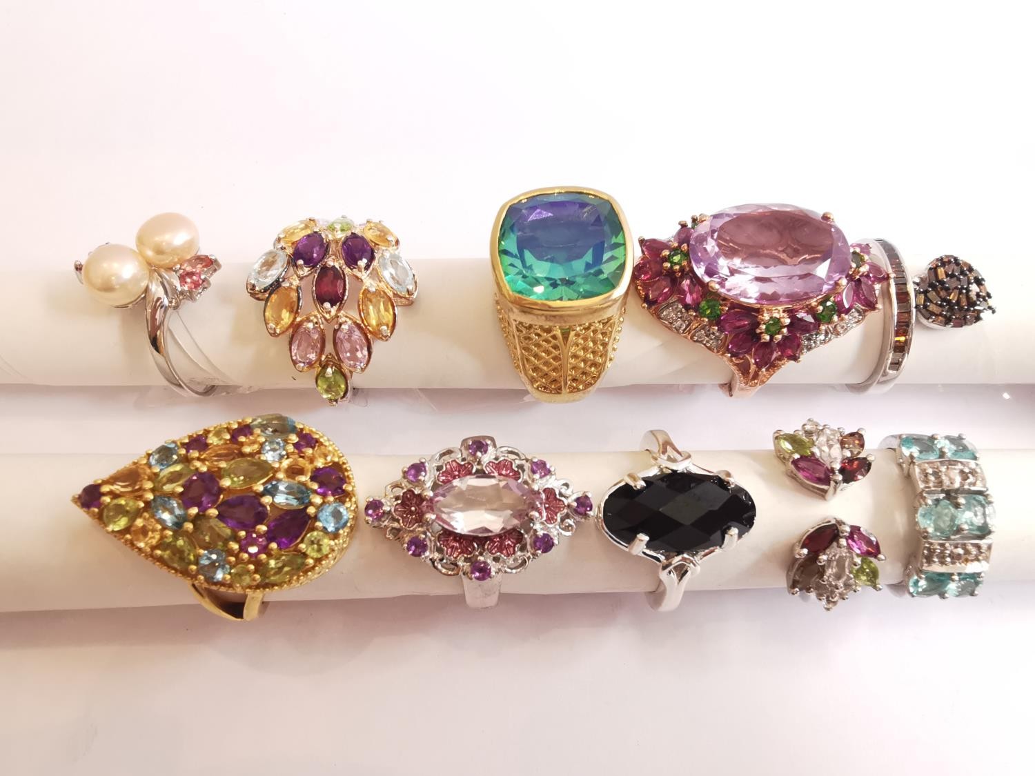 A collection of ten silver and gold plated silver dress rings set with various gemstones,