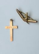 A 9 carat rose gold cross and 9 carat yellow boomerang and kangaroo brooch with secure pin to