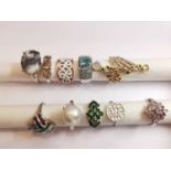 A collection of ten silver and gold plated silver dress rings set with various gemstones,