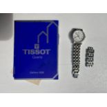 A ladies Tissot bi-metal quartz watch with articulated bracelet, white dial with roman numerals