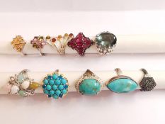 A collection of ten silver and gold plated silver dress rings set with various gemstones,