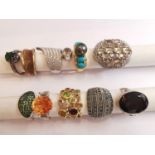 A collection of ten silver and gold plated silver dress rings set with various gemstones,
