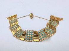 A Syrian/Arabic 21 carat yellow gold wide articulated chain link panel bracelet set with turquoise