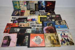 A collection of late 20th century record albums, to include; Bob Dylan, Simon & Garfunkel, Noel