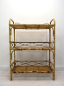 A mid 20th century bamboo three shelf floor standing shelving unit. H.112 W.80cm