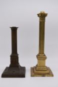 A gilt brass Corinthian column light fitting raised on stepped square base together with a patinated