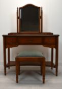 A contemporary mahogany three piece bedroom set to include dressing table mirror, three drawer