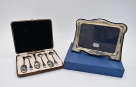 A cased set of six hallmarked silver spoons together with a boxed contemporary silver photograph