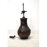 A Japanese Meiji period (1852-1912) bronze baluster vase cast with bird decoration (converted to a